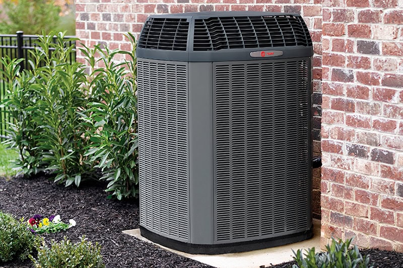 air conditioner installed outside of a home.
